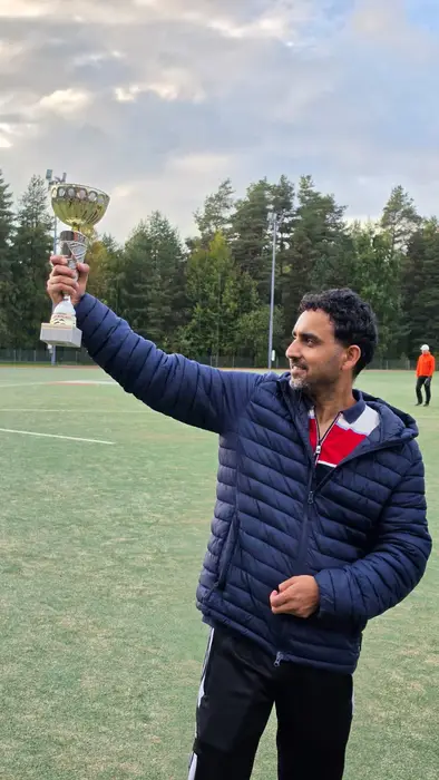 Trophy raised on the outfield