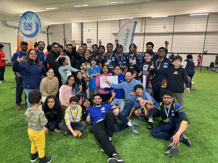 Players, families and supporters celebrate the title